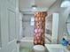Clean bathroom with shower/tub combo, vanity, and linen storage at 4590 San Heath Rd, Bartow, FL 33830