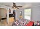 Bedroom with a queen bed, dresser, and ceiling fan at 4590 San Heath Rd, Bartow, FL 33830