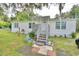 White manufactured home with landscaped yard at 4590 San Heath Rd, Bartow, FL 33830
