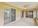 Sunlit Florida room with tiled floors and access to the backyard at 142 Morning Glory Cir, Winter Haven, FL 33884