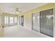 Bright Florida room with tiled floors and multiple sliding glass doors at 142 Morning Glory Cir, Winter Haven, FL 33884