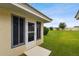Landscaped backyard with lush green grass and a storage shed at 142 Morning Glory Cir, Winter Haven, FL 33884