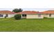 Spacious backyard with grassy lawn and mature trees at 142 Morning Glory Cir, Winter Haven, FL 33884