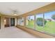 Sunroom with tiled floor and sliding glass doors to the backyard at 142 Morning Glory Cir, Winter Haven, FL 33884
