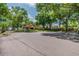 Gated community entrance with guard house and lush landscaping at 142 Morning Glory Cir, Winter Haven, FL 33884