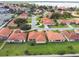 Community overview showcasing numerous homes near a lake at 142 Morning Glory Cir, Winter Haven, FL 33884