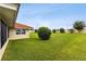 Expansive backyard with well-maintained lawn at 142 Morning Glory Cir, Winter Haven, FL 33884