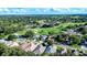 Aerial view showing home's location in a golf course community at 708 Canberra Rd, Winter Haven, FL 33884