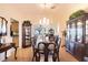 Elegant dining room with a large table, chandelier, and hardwood floors at 708 Canberra Rd, Winter Haven, FL 33884