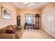 Home office with brown sofa, writing desk, and built-in shelving at 708 Canberra Rd, Winter Haven, FL 33884