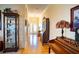 Inviting entryway with hardwood floors and antique furniture at 708 Canberra Rd, Winter Haven, FL 33884
