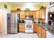 Well-equipped kitchen, featuring stainless steel appliances and granite countertops at 708 Canberra Rd, Winter Haven, FL 33884