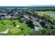 Aerial view of a house in a golf course community at 708 Canberra Rd, Winter Haven, FL 33884