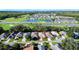 Aerial view of house with a large backyard in a residential neighborhood at 708 Canberra Rd, Winter Haven, FL 33884