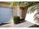 House exterior featuring a white door and garage at 708 Canberra Rd, Winter Haven, FL 33884