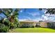 Spacious backyard with lush lawn and patio area at 708 Canberra Rd, Winter Haven, FL 33884