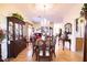 Formal dining room with a wood table and view into living room at 708 Canberra Rd, Winter Haven, FL 33884
