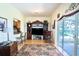Open living space with a view into kitchen and access to a screened patio at 708 Canberra Rd, Winter Haven, FL 33884