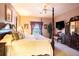 Main bedroom featuring a king-size bed, dresser, and flat-screen TV at 708 Canberra Rd, Winter Haven, FL 33884