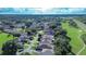 Aerial view of a house in a residential neighborhood near a golf course at 708 Canberra Rd, Winter Haven, FL 33884