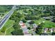 Aerial view of house near golf course and highway at 708 Canberra Rd, Winter Haven, FL 33884
