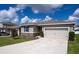 Modern one-story home with attached garage and curb appeal at 343 Lake Smart Cir, Winter Haven, FL 33881