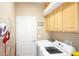 Washer and dryer in a functional laundry room at 3832 Traditions N Blvd, Winter Haven, FL 33884