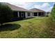 Two homes with screened patios and spacious grassy backyard at 3832 Traditions N Blvd, Winter Haven, FL 33884