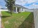 Landscaped backyard with privacy fence at 991 First Dr, Eagle Lake, FL 33839