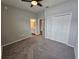 Bright bedroom with ceiling fan and double door closet at 991 First Dr, Eagle Lake, FL 33839