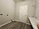 Laundry room with built in shelving and counter space at 991 First Dr, Eagle Lake, FL 33839