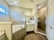 Bathroom with soaking tub, shower, and double vanity at 991 First Dr, Eagle Lake, FL 33839