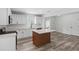 Open concept kitchen with white shaker cabinets and a kitchen island at 5303 Tillman Rd, Lakeland, FL 33810