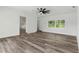 Bright living room with wood-look floors and access to backyard at 5303 Tillman Rd, Lakeland, FL 33810