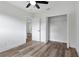Charming bedroom with wood-look floors and a walk-in closet at 5303 Tillman Rd, Lakeland, FL 33810
