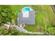 High-angle view of a home with pool and surrounding landscape at 5303 Tillman Rd, Lakeland, FL 33810
