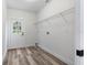 Laundry room with vinyl flooring and overhead shelving at 5303 Tillman Rd, Lakeland, FL 33810