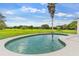 Refreshing kidney-shaped pool and spacious patio area, perfect for summer fun at 5303 Tillman Rd, Lakeland, FL 33810