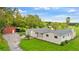 Stunning aerial view of a ranch-style home with detached barn and expansive yard at 5303 Tillman Rd, Lakeland, FL 33810