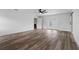 Spacious bedroom with wood-look floors and door leading to backyard at 5303 Tillman Rd, Lakeland, FL 33810