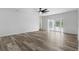 Spacious living area featuring wood-look floors and French doors leading to a pool at 5303 Tillman Rd, Lakeland, FL 33810
