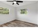Well-lit bedroom with wood-look floors and ceiling fan at 5303 Tillman Rd, Lakeland, FL 33810