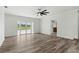 Spacious living area with vinyl plank flooring and access to a patio at 5303 Tillman Rd, Lakeland, FL 33810