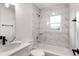 Clean bathroom with marble tile, bathtub, and single vanity at 5303 Tillman Rd, Lakeland, FL 33810