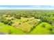 Aerial view of a property with a house and surrounding farmland at 5303 Tillman Rd, Lakeland, FL 33810