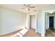 Bedroom with ceiling fan and closet, plus hallway view at 336 Lake Eloise Pointe Dr, Winter Haven, FL 33880