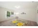 Well-lit bedroom with carpeted floors and large window at 5539 Scott Lake Creek Ct, Lakeland, FL 33813