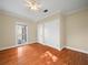 Bright bedroom with hardwood floors and double closets at 1303 Mirror Nw Ter, Winter Haven, FL 33881