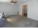 Open living room with view into kitchen and hallway at 2201 W Pilaklakaha Ave, Auburndale, FL 33823