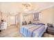 Guest bedroom with a full-size bed and window coverings at 34415 Kingfish St, Fruitland Park, FL 34731